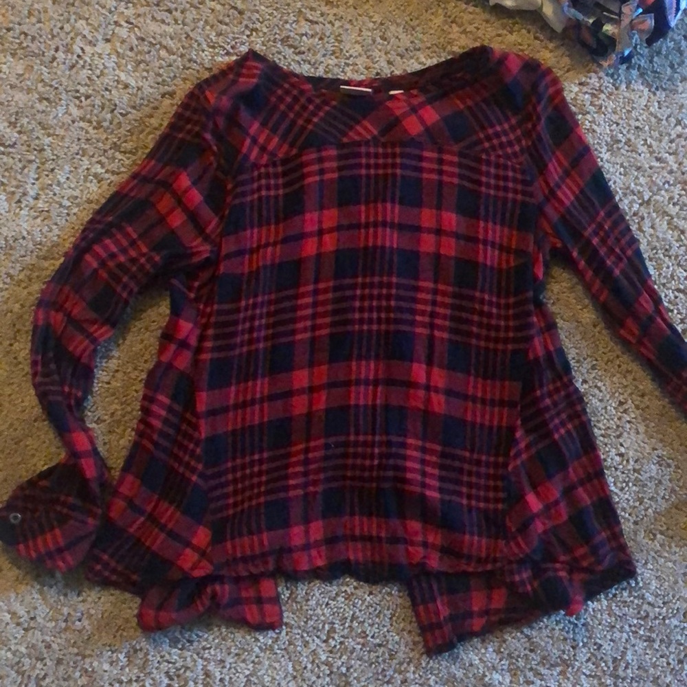 Boutique Plaid top with button back detail.